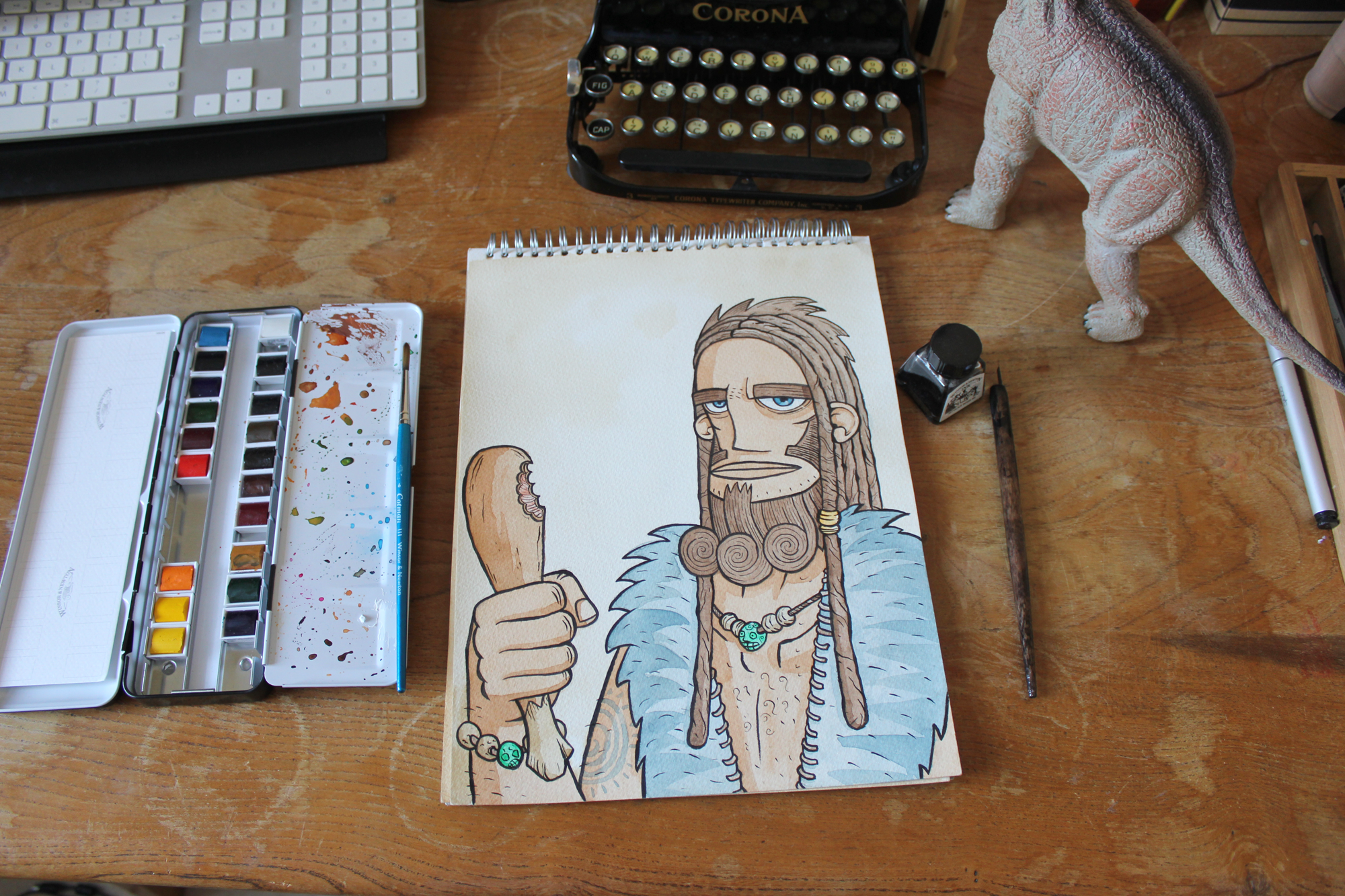 prehistoric caveman illustration on illustrators desk